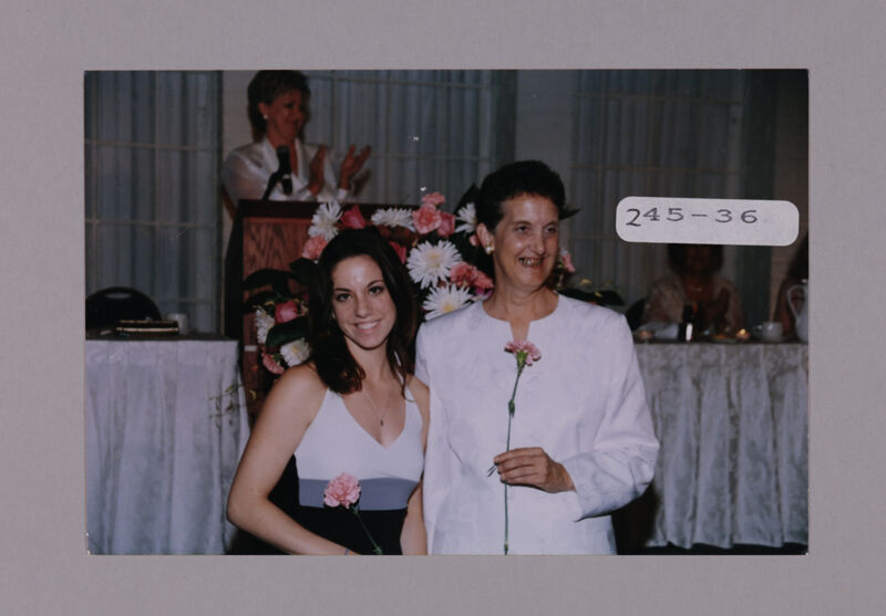 Mother and Daughter with Carnations at Convention Photograph 2, July 7-10, 2000 (Image)