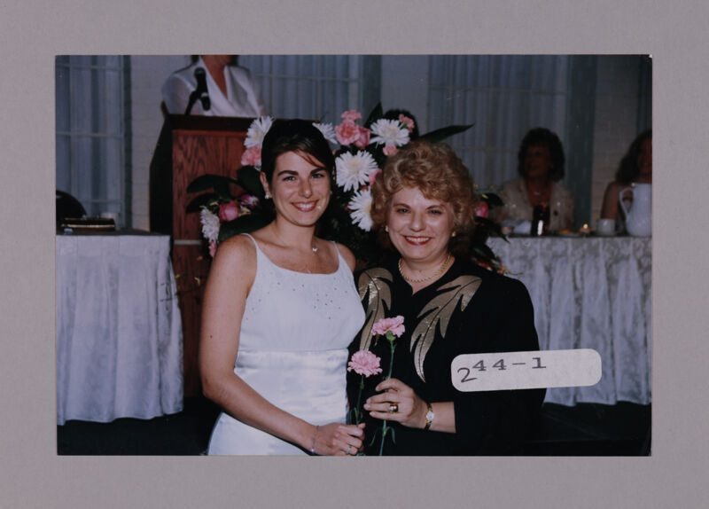 Mother and Daughter with Carnations at Convention Photograph 1, July 7-10, 2000 (Image)