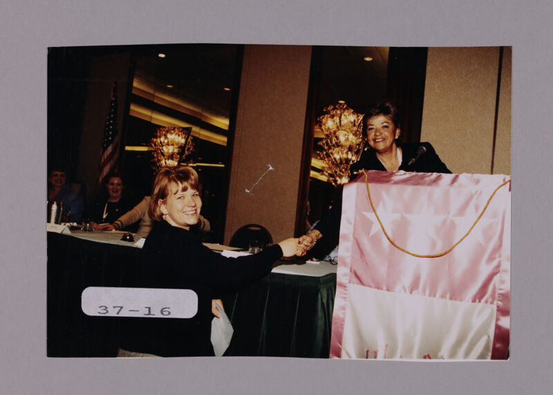 Penny Cupp Congratulating Unidentified Phi Mu at Convention Photograph, July 7-10, 2000 (Image)