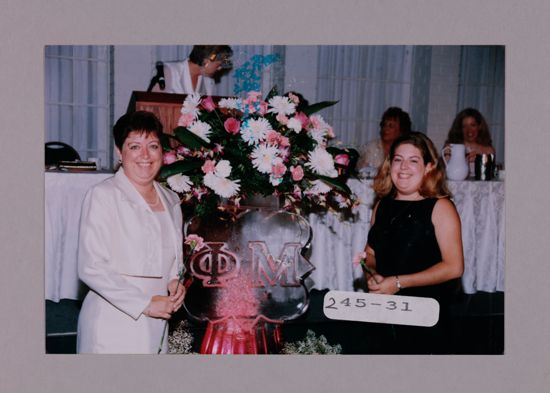 Susie McNamara and Daughter by Convention Ice Sculpture Photograph, July 7-10, 2000 (image)