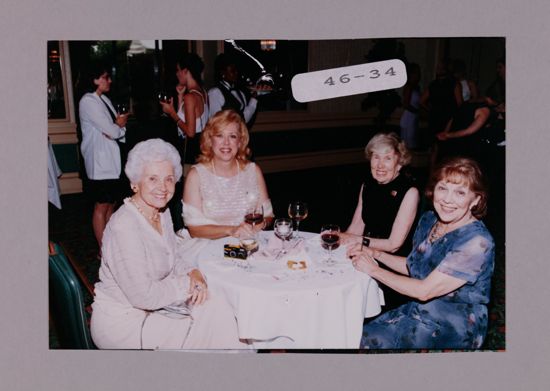 Campbell, Unidentified, Peterson, and Henson at Convention Reception Photograph, July 7-10, 2000 (image)