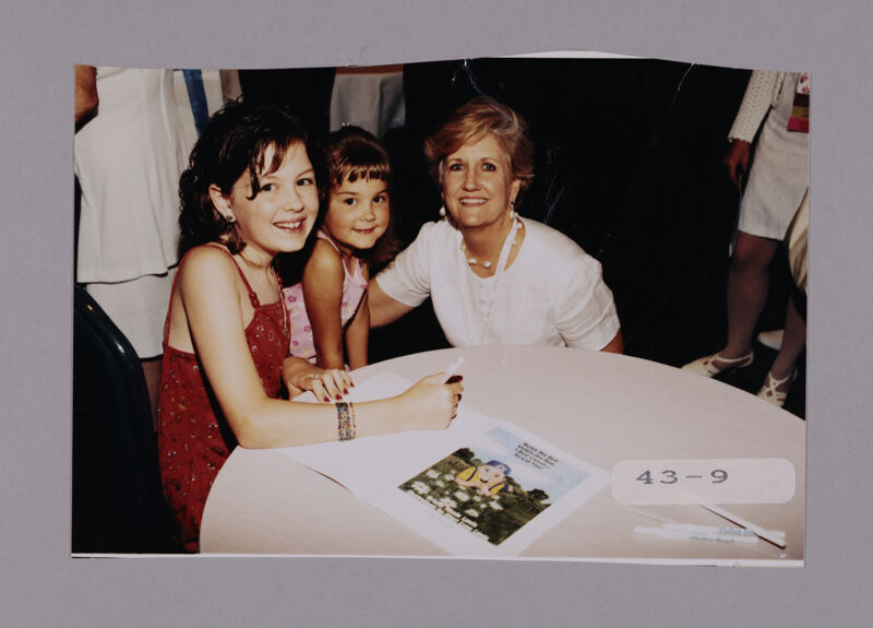Unidentified Phi Mu with Children at Convention Photograph, July 7-10, 2000 (Image)