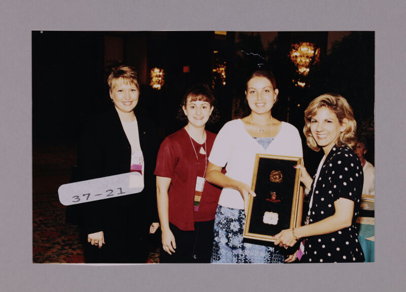 Four Phi Mus with Plaque at Convention Photograph, July 7-10, 2000 (Image)