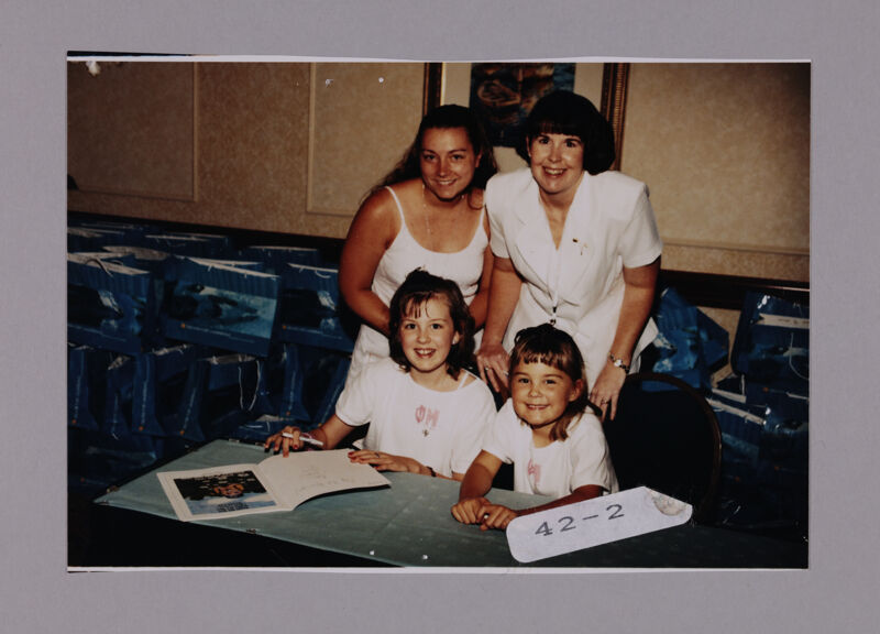 Two Phi Mus with Children at Convention Photograph 1, July 7-10, 2000 (Image)