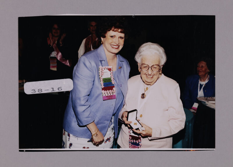 Kathie Garland and Leona Hughes with Pin at Convention Photograph, July 7-10, 2000 (Image)