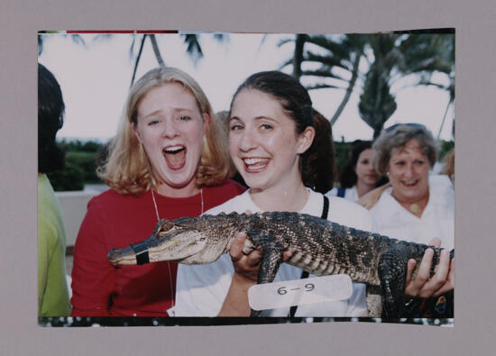 Two Phi Mus Holding Crocodile at Convention Opening Dinner Photograph 2, July 7-10, 2000 (image)