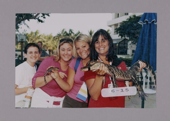 Ashley McDaniel and Three Phi Mus with Crocodiles at Convention Opening Dinner Photograph, July 7-10, 2000 (image)