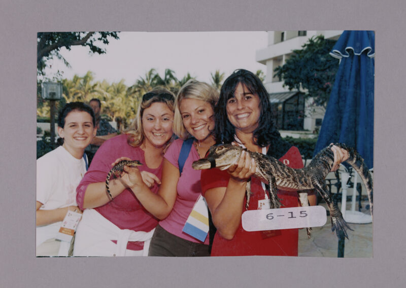 Ashley McDaniel and Three Phi Mus with Crocodiles at Convention Opening Dinner Photograph, July 7-10, 2000 (Image)