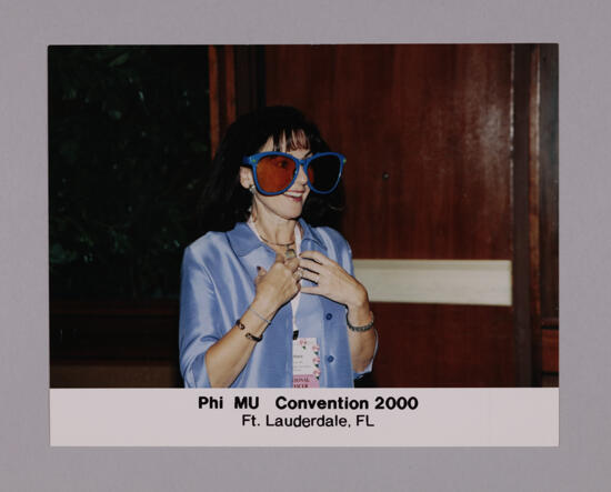 Barbara Little Wearing Oversized Sunglasses at Convention Photograph 2, July 7-10, 2000 (image)