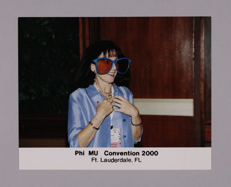 Barbara Little Wearing Oversized Sunglasses at Convention Photograph 2, July 7-10, 2000 (Image)