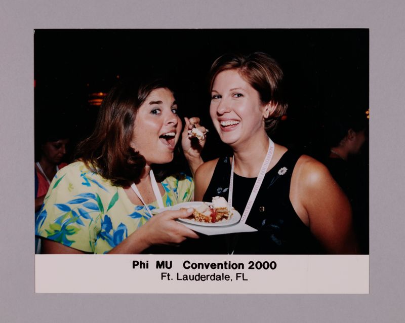 July 7-10 Two Phi Mus Eating Cake at Convention Photograph Image