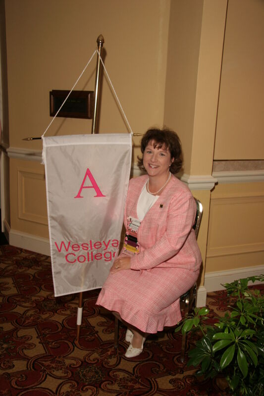 Frances Mitchelson With Alpha Chapter Flag at Convention Photograph 1, July 2006 (Image)