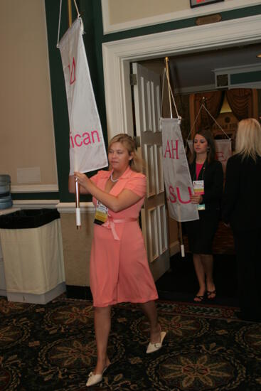 Laura Goodell with Gamma Delta Chapter Flag in Convention Parade Photograph 2, July 2006 (image)