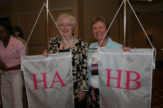 Claudia Nemir and Gretchen Johnson With Chapter Flags at Convention Photograph, July 2006 (image)