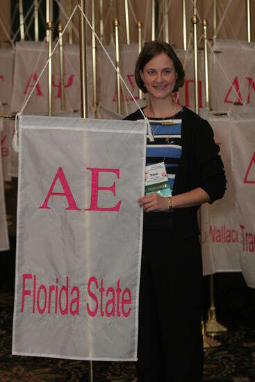 Sam Garrett by Alpha Epsilon Chapter Flag at Convention Photograph 2, July 2006 (image)