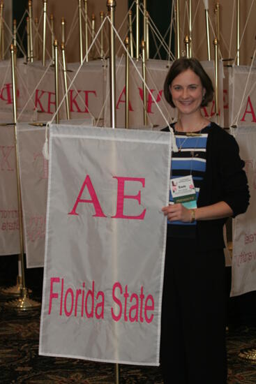 Sam Garrett by Alpha Epsilon Chapter Flag at Convention Photograph 1, July 2006 (image)