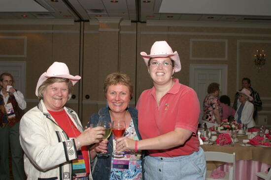 Gretchen Johnson and Two Unidentified Phi Mus at Convention 1852 Dinner Photograph 2, July 14, 2006 (image)