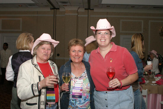 Gretchen Johnson and Two Unidentified Phi Mus at Convention 1852 Dinner Photograph 1, July 14, 2006 (image)