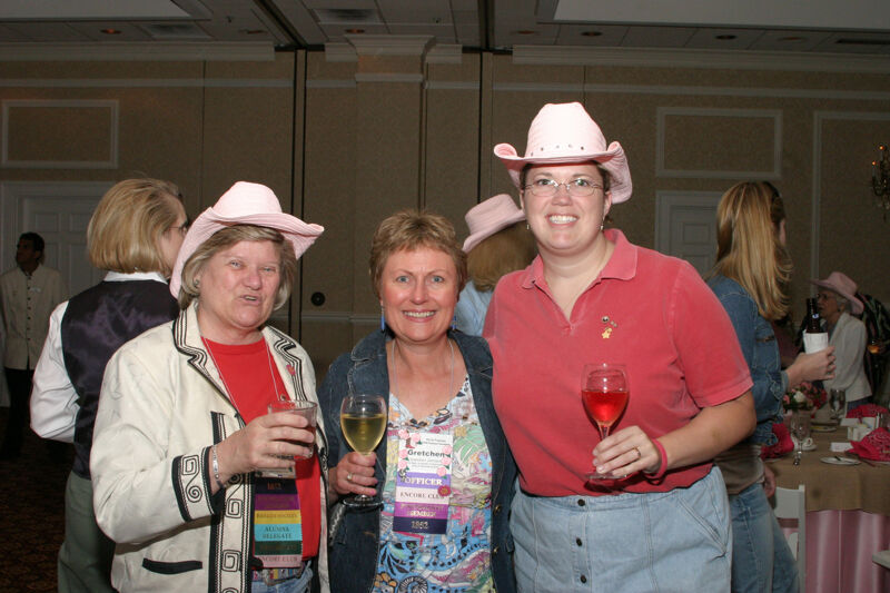 Gretchen Johnson and Two Unidentified Phi Mus at Convention 1852 Dinner Photograph 1, July 14, 2006 (Image)