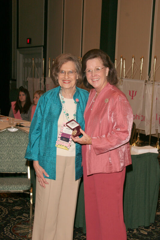 Shellye McCarty and Joan Wallem With Pin at Friday Convention Session Photograph 2, July 14, 2006 (Image)