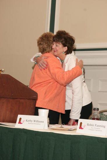 Kathy Williams Hugging Unidentified Phi Mu at Friday Convention Session Photograph, July 14, 2006 (image)