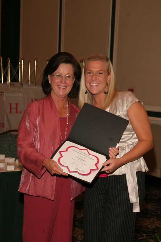 Shellye McCarty and Emily Crossett With Certificate at Friday Convention Session Photograph, July 14, 2006 (Image)