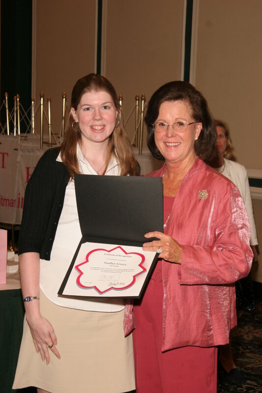 Shellye McCarty and Heather Kovacs With Certificate at Friday Convention Session Photograph, July 14, 2006 (Image)