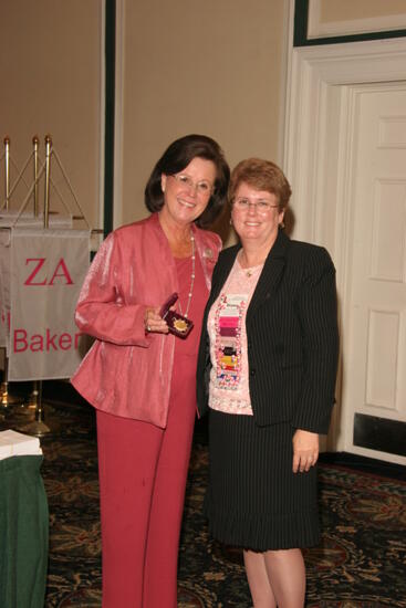 Shellye McCarty and Diane Eggert With Pin at Friday Convention Session Photograph 1, July 14, 2006 (image)