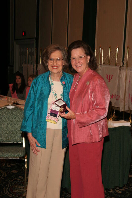Shellye McCarty and Joan Wallem With Pin at Friday Convention Session Photograph 1, July 14, 2006 (Image)