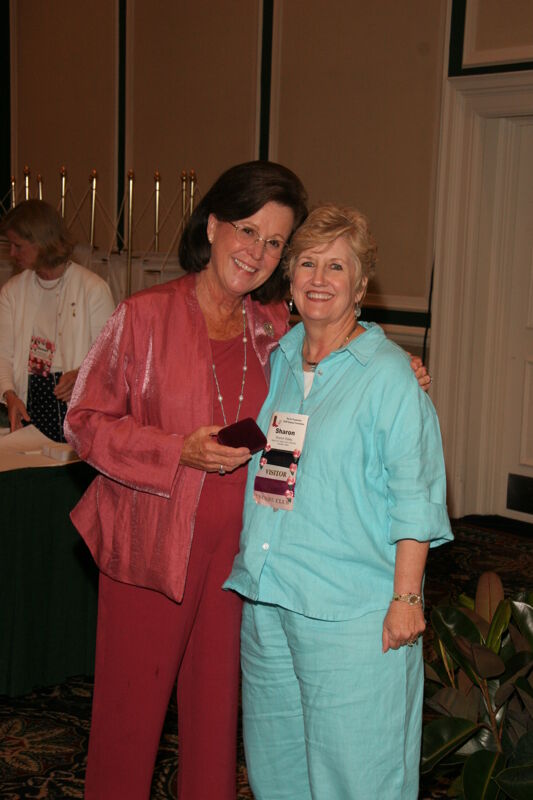 Shellye McCarty and Sharon Staley With Pin at Friday Convention Session Photograph, July 14, 2006 (Image)