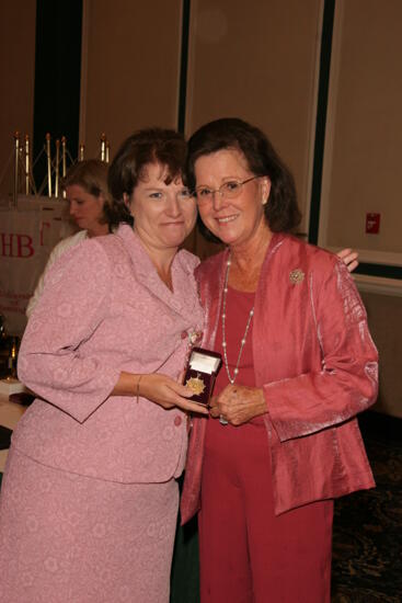 Shellye McCarty and Frances Mitchelson With Pin at Friday Convention Session Photograph, July 14, 2006 (image)