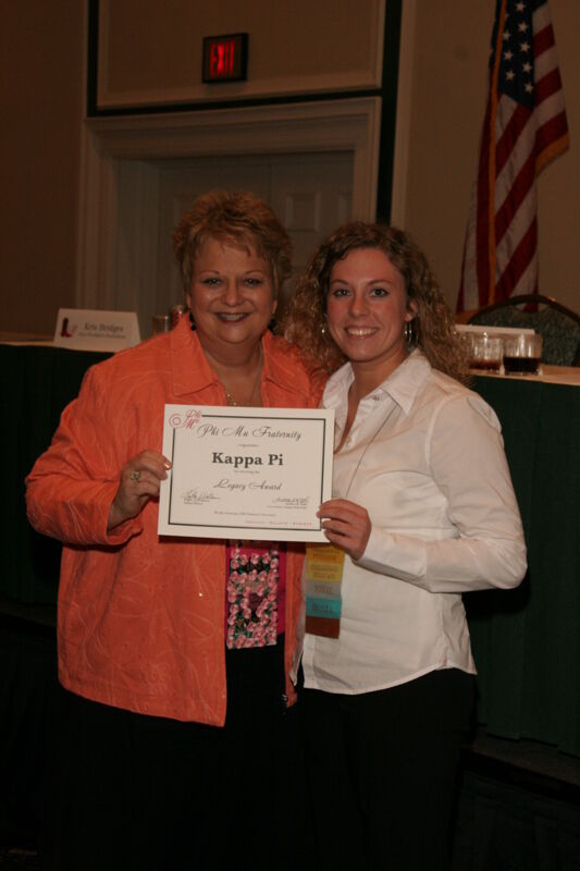 Kathy Williams and Kappa Pi Chapter Member With Legacy Award at Friday Convention Session Photograph, July 14, 2006 (Image)