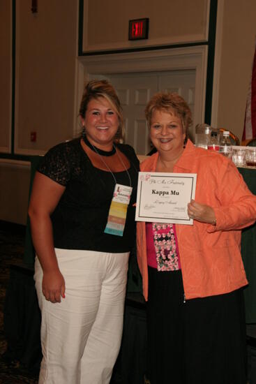 Kathy Williams and Kappa Mu Chapter Member With Legacy Award at Friday Convention Session Photograph, July 14, 2006 (image)