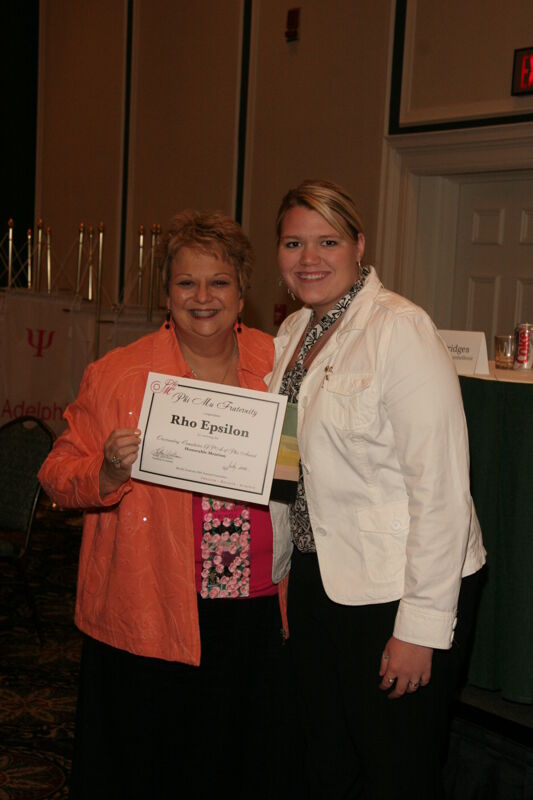 Kathy Williams and Rho Epsilon Chapter Member With Certificate at Friday Convention Session Photograph 2, July 14, 2006 (Image)