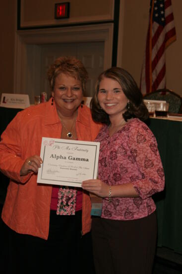 Kathy Williams and Alpha Gamma Chapter Member With Certificate at Friday Convention Session Photograph, July 14, 2006 (image)