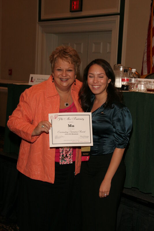July 14 Kathy Williams and Mu Chapter Member With Certificate at Friday Convention Session Photograph Image