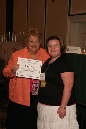 Kathy Williams and Rho Zeta Chapter Member With Certificate at Friday Convention Session Photograph, July 14, 2006 (image)