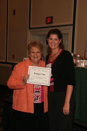 Kathy Williams and Kappa Tau Chapter Member With Certificate at Friday Convention Session Photograph, July 14, 2006 (image)