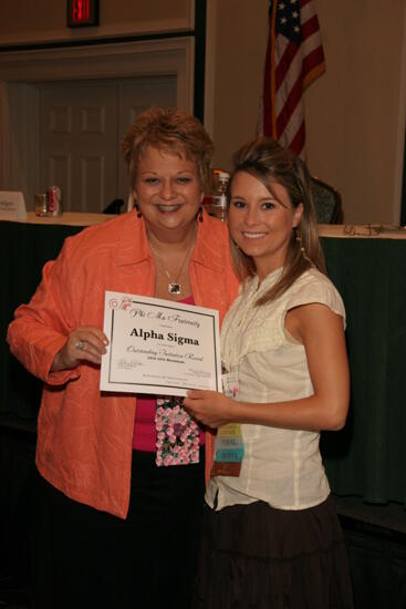 Kathy Williams and Alpha Sigma Chapter Member With Certificate at Friday Convention Session Photograph 1, July 14, 2006 (image)