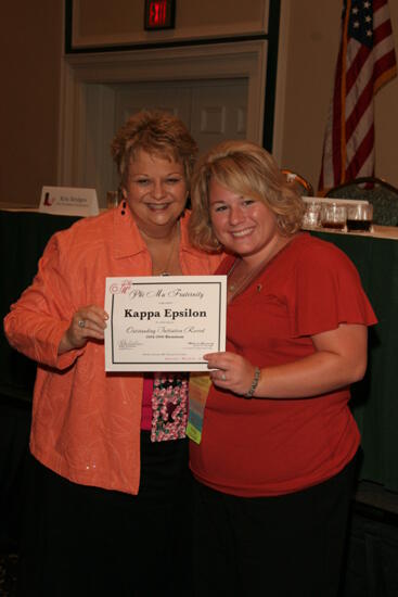 Kathy Williams and Kappa Epsilon Chapter Member With Certificate at Friday Convention Session Photograph 1, July 14, 2006 (image)