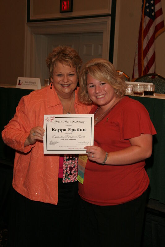 Kathy Williams and Kappa Epsilon Chapter Member With Certificate at Friday Convention Session Photograph 1, July 14, 2006 (Image)