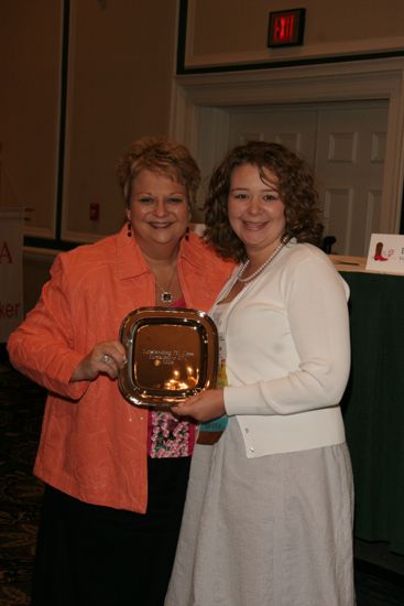 Kathy Williams and Unidentified With Award at Friday Convention Session Photograph 1, July 14, 2006 (image)