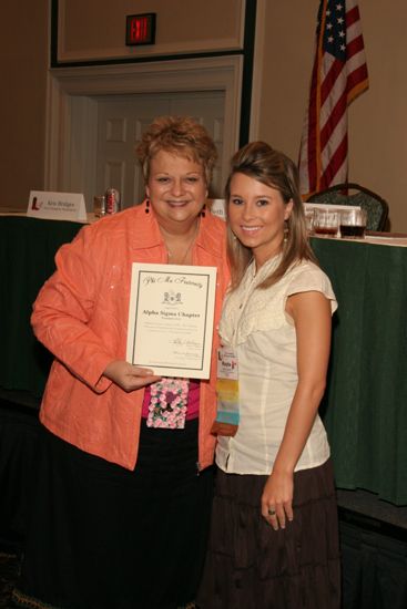 Kathy Williams and Alpha Sigma Chapter Member With Certificate at Friday Convention Session Photograph 2, July 14, 2006 (image)