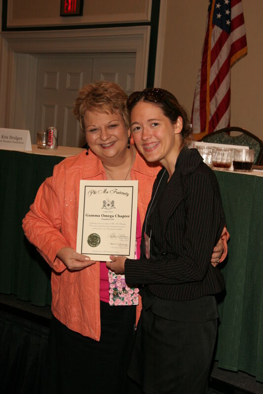 Kathy Williams and Gamma Omega Chapter Member With Certificate at Friday Convention Session Photograph, July 14, 2006 (Image)