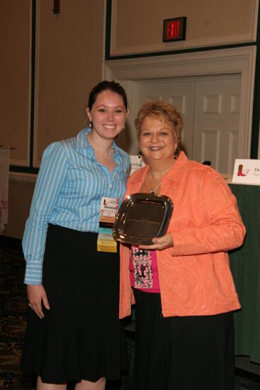 Kathy Williams and Delta Omega Chapter Member With Award at Friday Convention Session Photograph 2, July 14, 2006 (image)