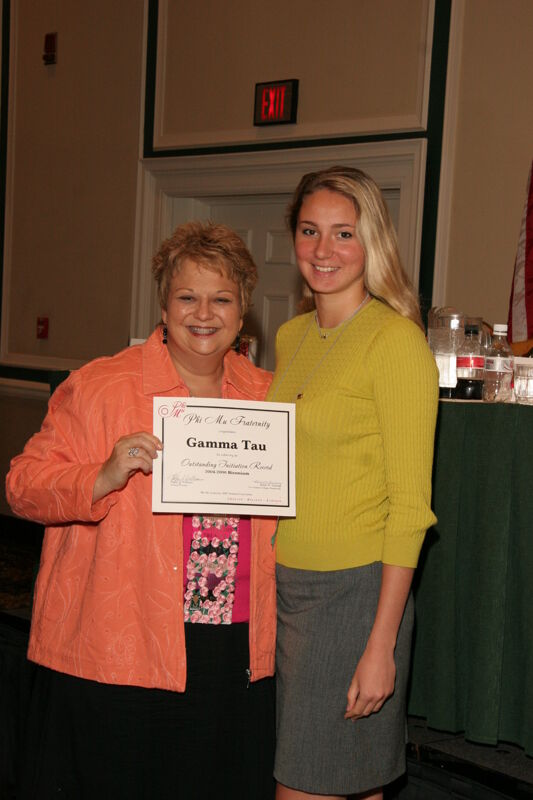 July 14 Kathy Williams and Gamma Tau Chapter Member With Certificate at Friday Convention Session Photograph 1 Image