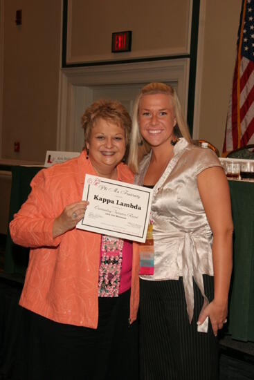 Kathy Williams and Kappa Lambda Chapter Member With Certificate at Friday Convention Session Photograph, July 14, 2006 (image)