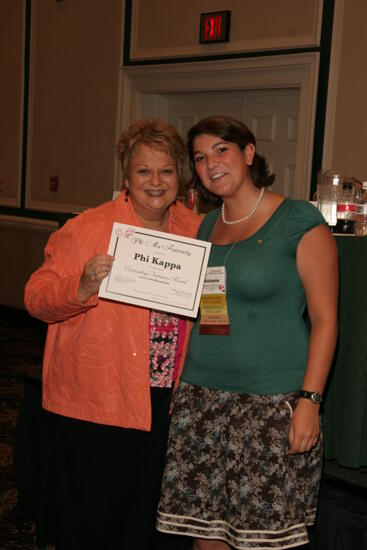 Kathy Williams and Phi Kappa Chapter Member With Certificate at Friday Convention Session Photograph, July 14, 2006 (image)