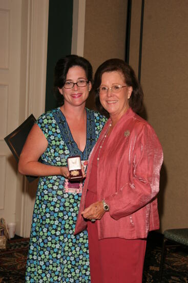 Shellye McCarty and Mary Helen Griffis With Pin at Friday Convention Session Photograph, July 14, 2006 (image)