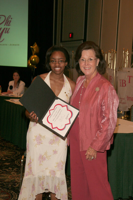 Shellye McCarty and Zeta Alpha Chapter Member With Certificate at Friday Convention Session Photograph, July 14, 2006 (Image)